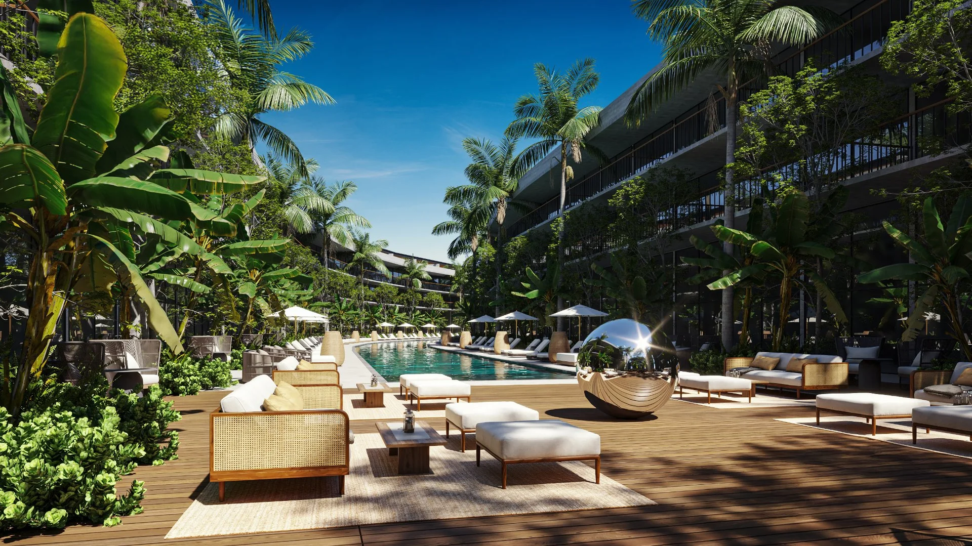 Área de alberca con jardines tropicales en Aura by AWA, Playa del Carmen