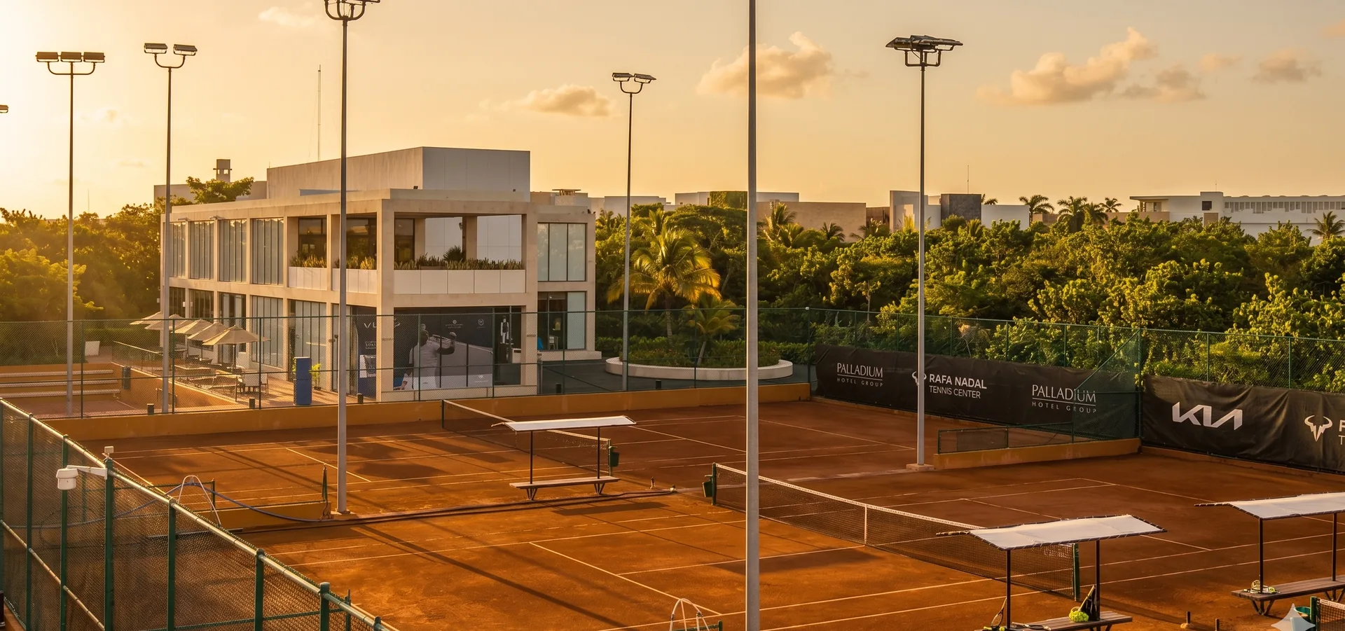 Professional clay tennis court at Rafa Nadal Tennis Centre Costa Mujeres at sunrise