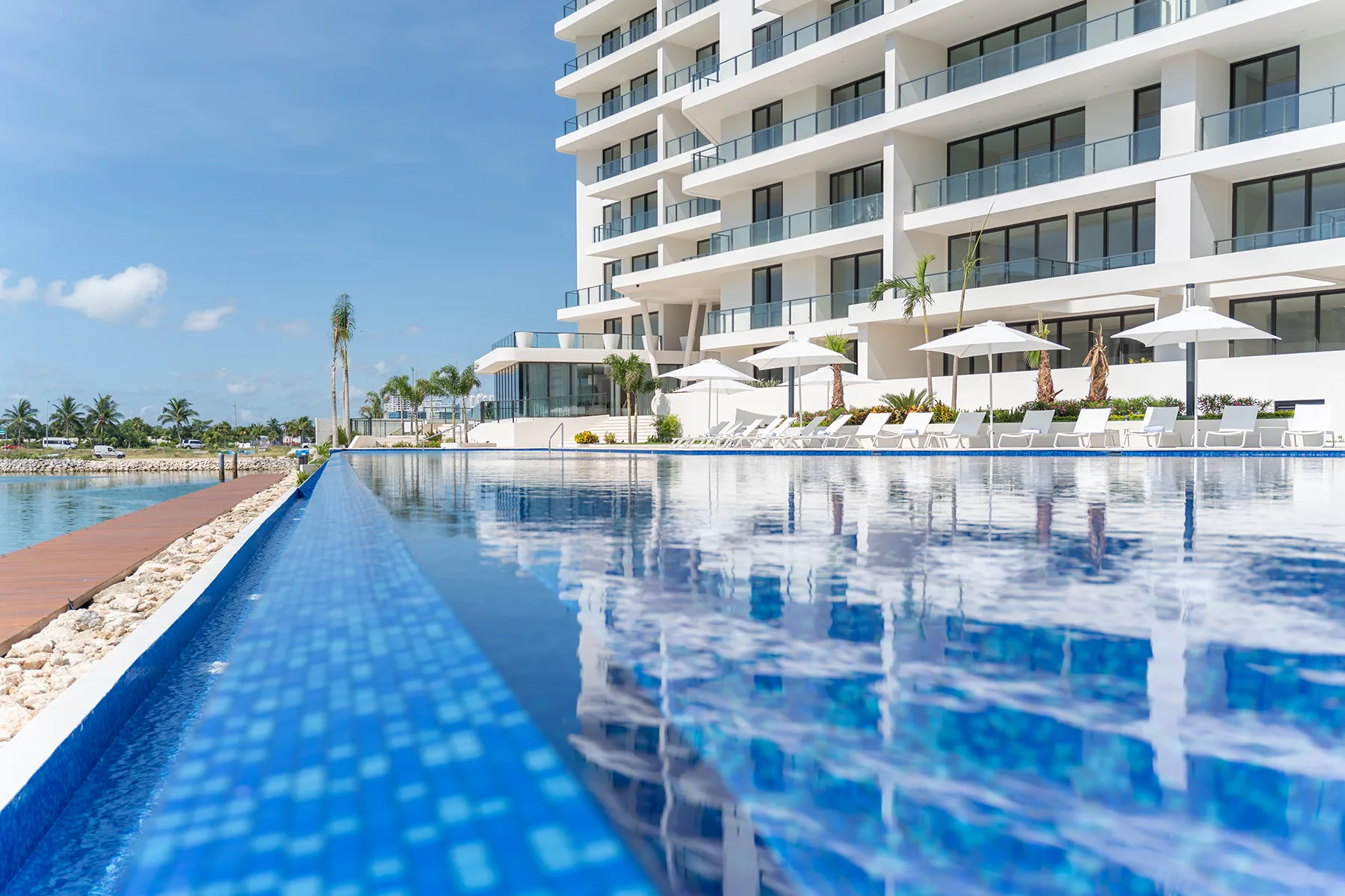 Blume Boutique Condos Puerto Cancun — infinity pool facing the marina, last 2 units available