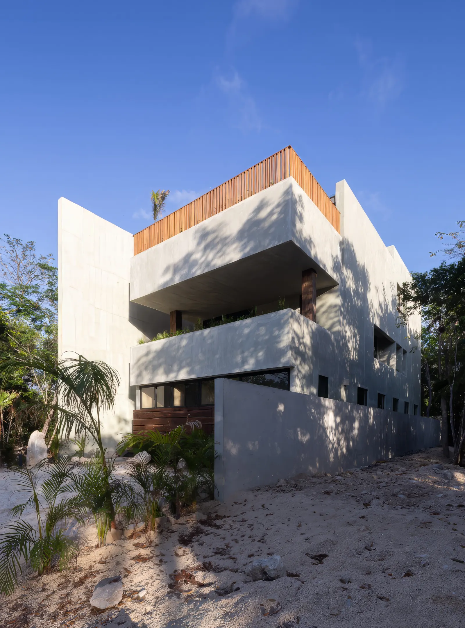 Fachada lateral acabados arquitectonicos casa maria - Casa María