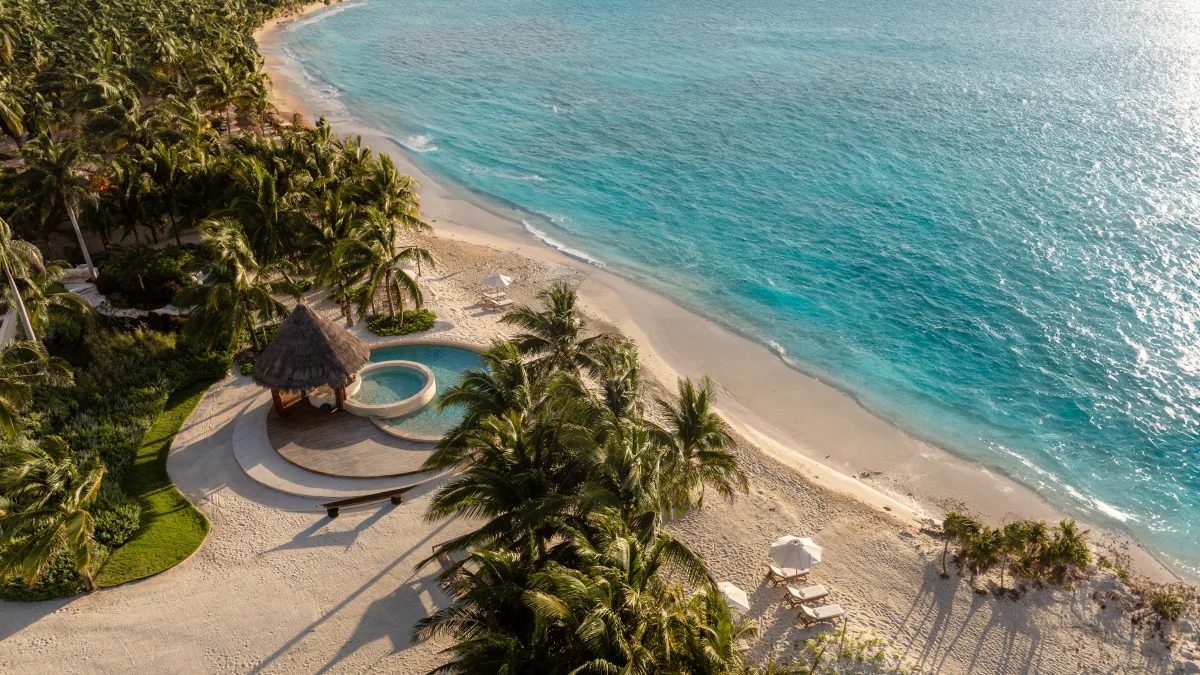 Costa Beach Club Corasol aerial view — 42,000 m² with 120 meters of private beach and palapas facing the Caribbean