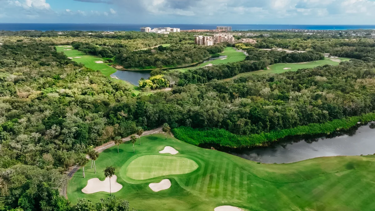 Gran Coyote Golf Corasol designed by Nick Price — 18 holes par 71 with fairway, natural lakes and Caribbean Sea view