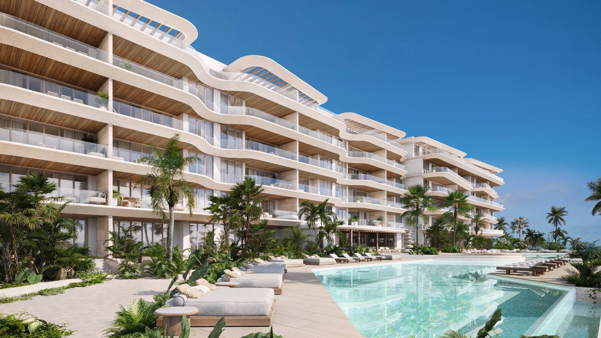 Piscina con camastros y amenidades en condominio Marietta Isla Mujeres