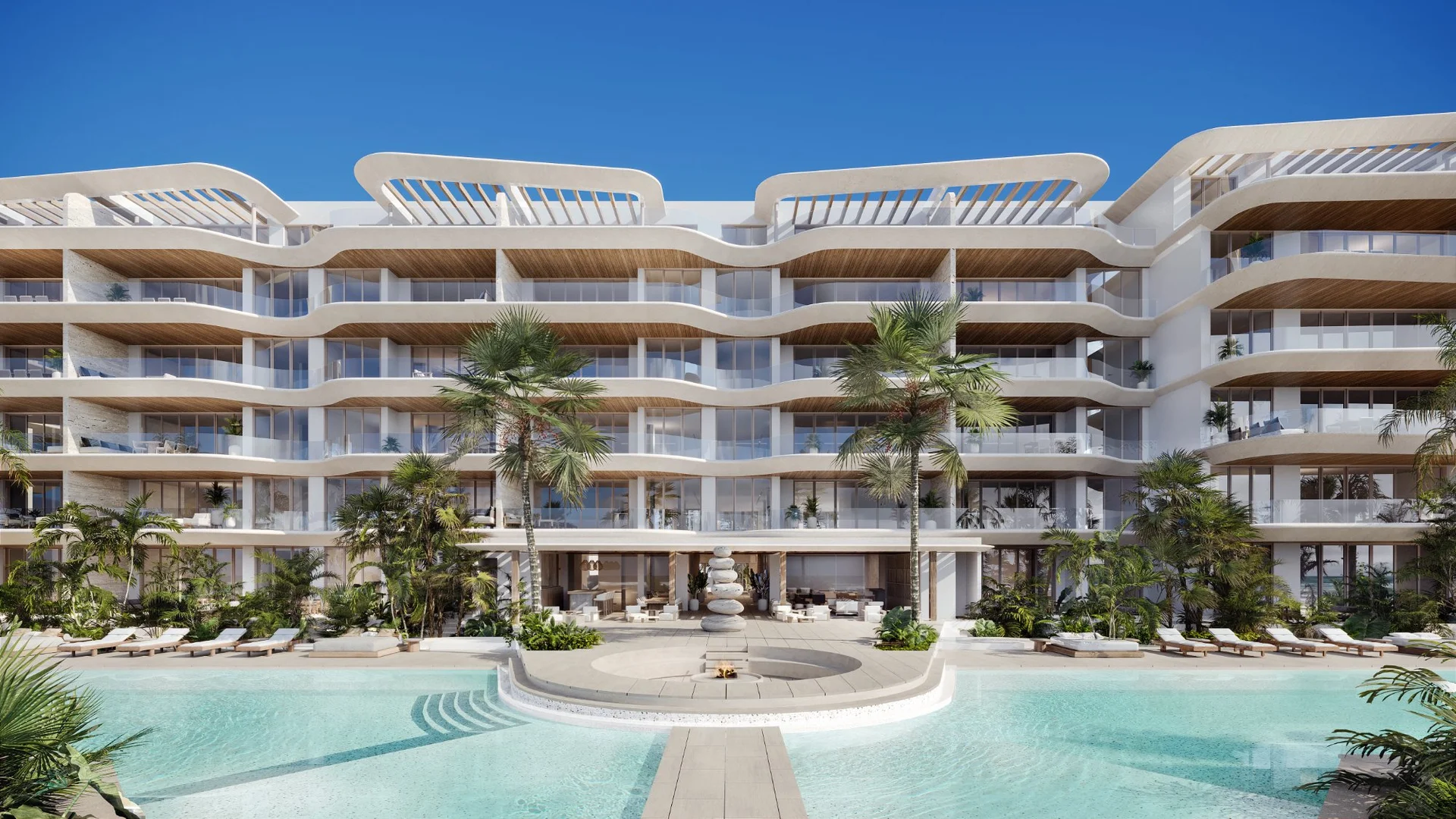 Lobby central con piscina y palmeras en Marietta Isla Mujeres, Kelman Desarrollos
