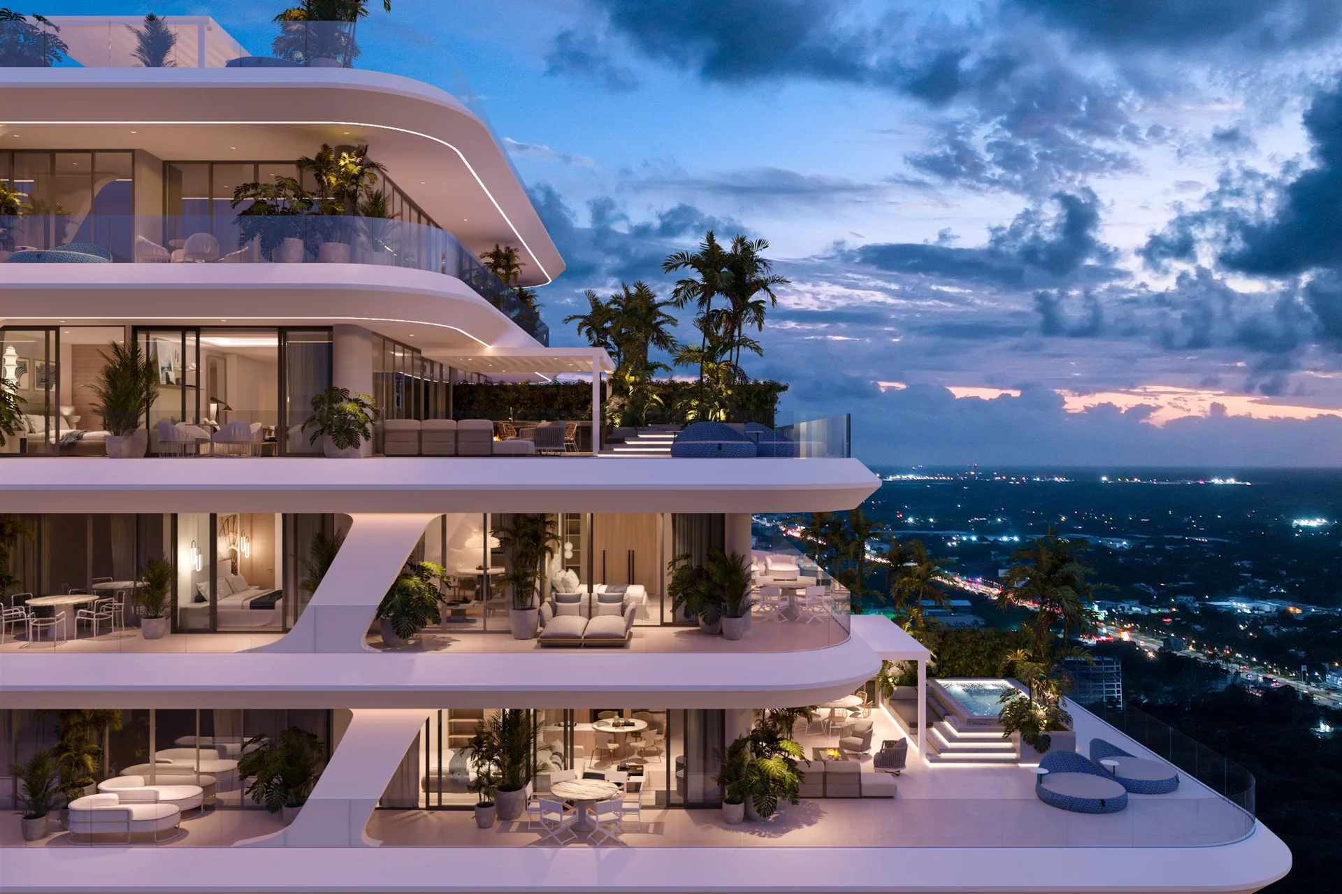 Terraza de departamento de lujo con vista a la ciudad de Cancún de noche en Nautica Residences