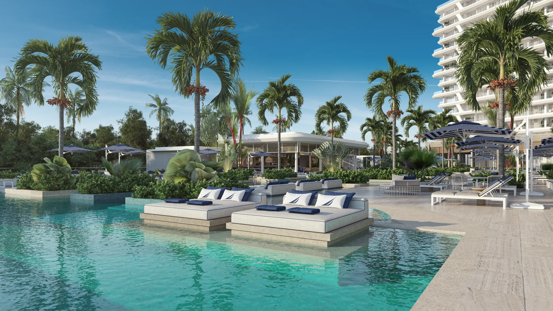 Vista aérea de las torres residenciales de lujo Nautica Residences entre la selva de Cancún