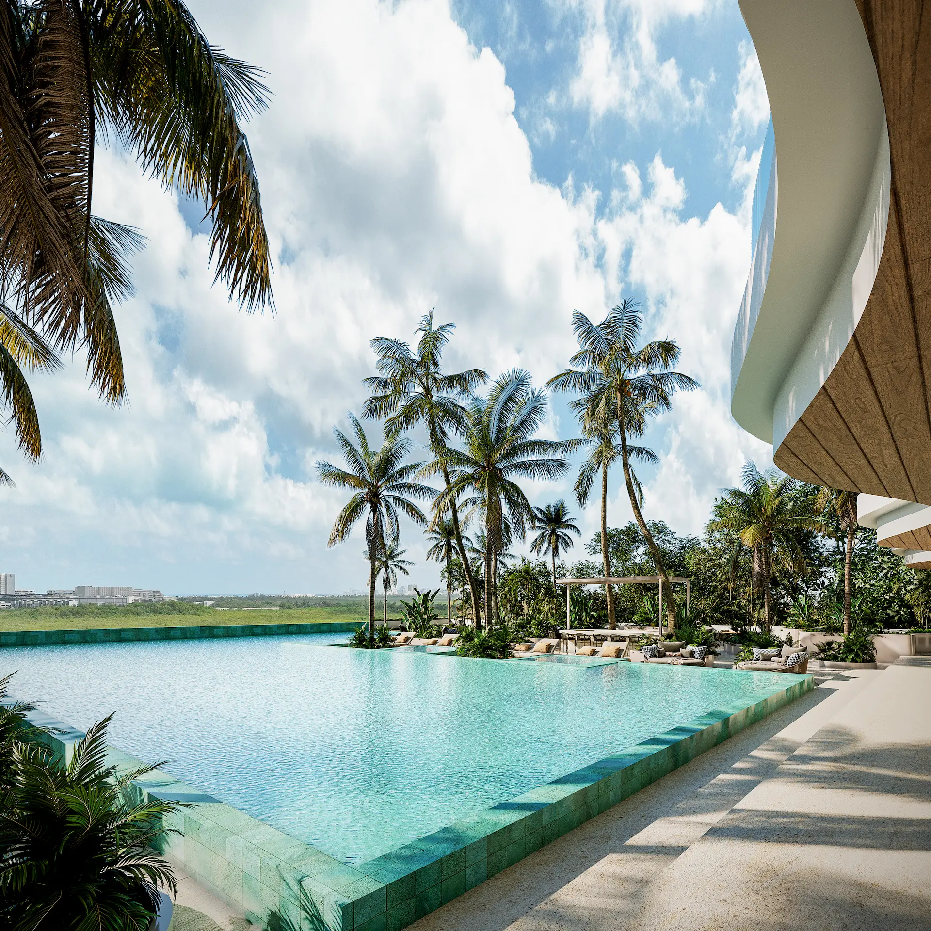 Infiniti Pool con palmeras tropicales y vistas a la reserva natural protegida en Torre Insignia Puerto Cancún